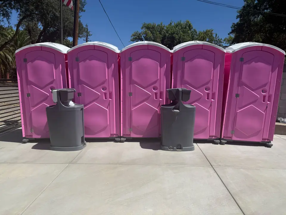 Event porta potties lined up with hand washing stations in Powell County, KY