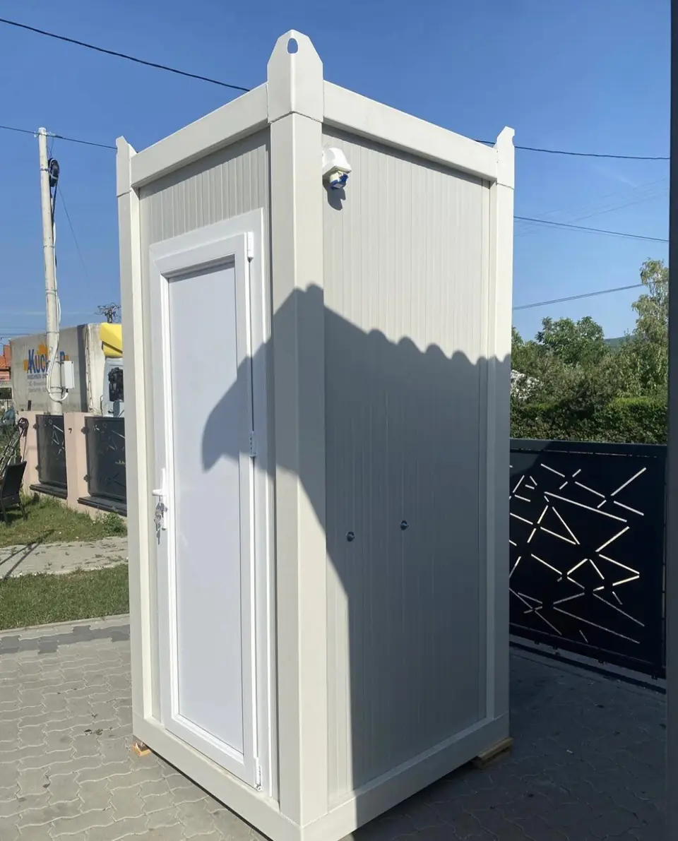 White flushing portable toilet with a paneled door
